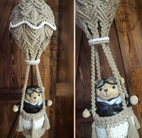 Handmade macrame hot air balloon decoration with small doll passenger in basket, shown from front and back views